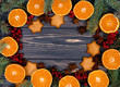 Christmas background. Mandarins, gingerbread and Christmas tree