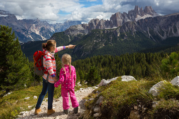 Wall Mural - two tourist girls at the Dolomites