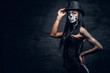 © Fxquadro - A girl in stylish top hat with skull make up.