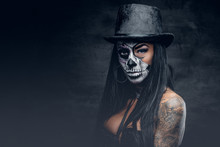 A Woman With Skull Make Up In Top Hat On Halloween.