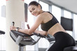 © zinkevych - Smiling girl using treadmill in a gym