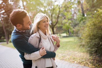 Wall Mural - loving couple walking in park