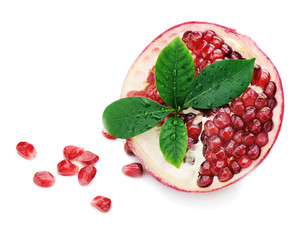 Wall Mural - Pomegranate fruit with green leaves isolated on white background.