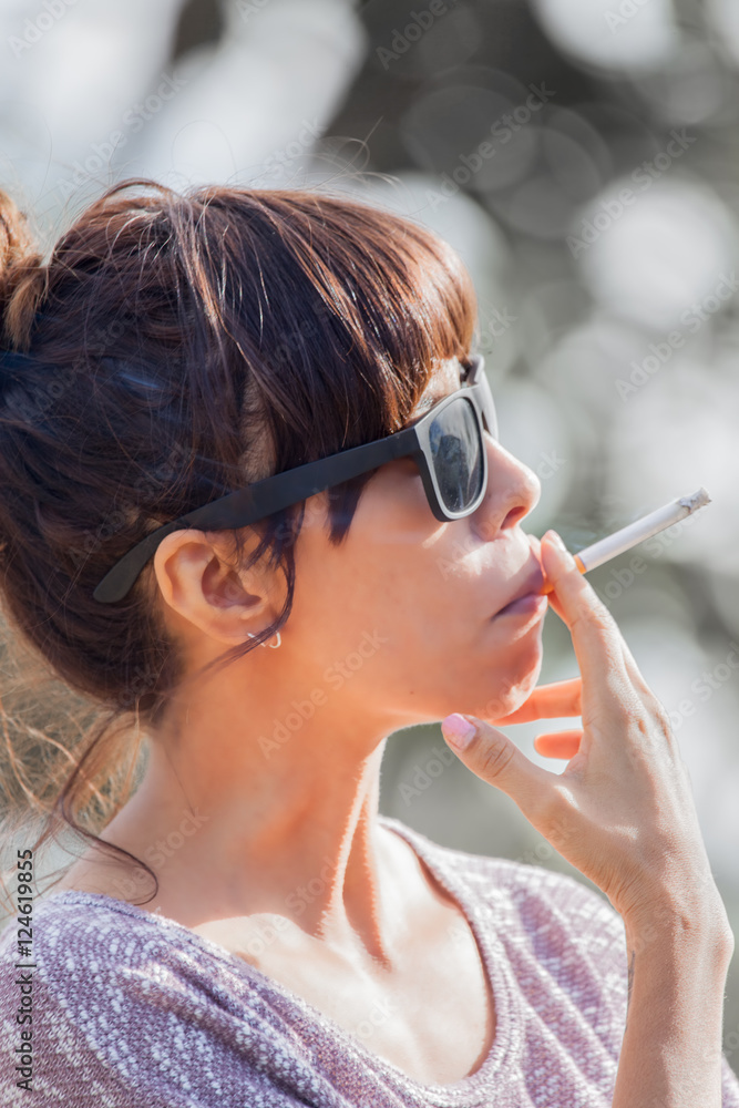 Pretty woman smoking a cigarette Stock Photo