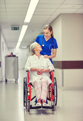 Poster - nurse with senior woman in wheelchair at hospital