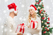 © Syda Productions - happy couple at home exchanging christmas gifts