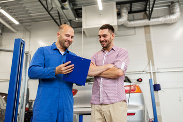 Poster - auto mechanic with clipboard and man at car shop