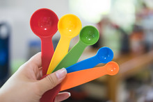 Colorful Measuring Spoon In Hand