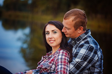 Passionate love in the autumn park. A young couple