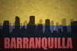 abstract silhouette of the city with text Barranquilla at the vintage colombian flag