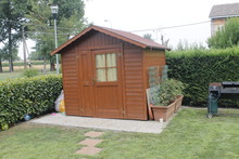 Wooden Shed For Tools In The Garden