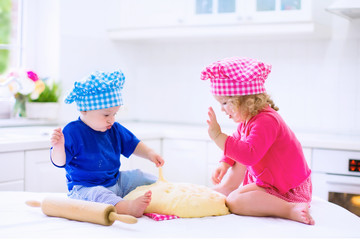 Kids baking in a white kitchen