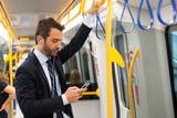 Businessman commuter traveling on the metro underground