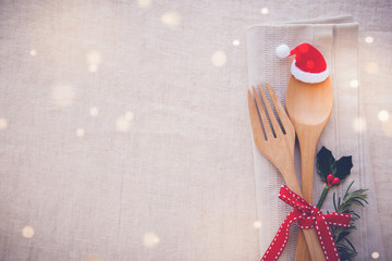 Wall Mural - Christmas table place setting, holidays copy space fairy light toning background