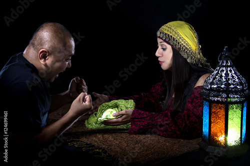 Fotografia, Obraz Gullible patron with scam artist or fraudulent psychic fortune teller