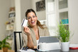 © Dirima - Happy woman using laptop and showing credit card for online shopping concept.