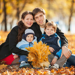 Happy family in the autumn park