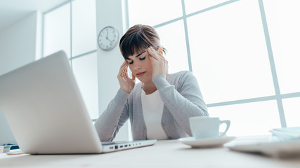 Wall Mural - Exhausted businesswoman with headache