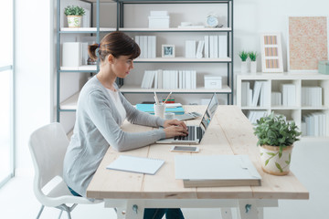 Poster - Confident businesswoman working at desk