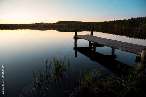 Pier on a lake at sunset