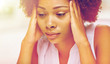 © Syda Productions - close up of african young woman touching her head