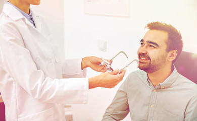 Canvas Print - optician with trial frame and patient at clinic