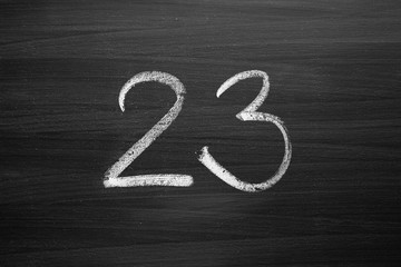 Wall Mural - number twenty three enumeration written with a chalk on the blackboard