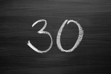 Wall Mural - number thirty enumeration written with a chalk on the blackboard