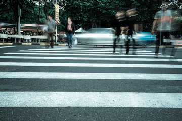 Wall Mural - Crosswalk and pedestrian at modern city zebra crossing street. Blur abstract.