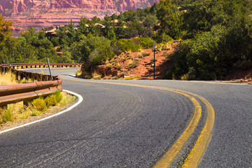 Winding road with yellow dividing lines through Arizona