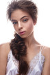 © iulskaya_photo - Beautiful girl in image of bride with plait. Model with nude makeup and silk underwear. Beauty face. Photo was taken in a studio.