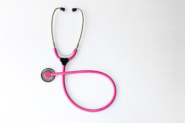 Pink colour stethoscopes isolated on white background