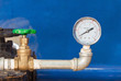 Water gauge pressure and valve in control room.