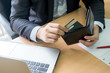 © yingzaast - businessman bring credit card out from wallet for shopping online