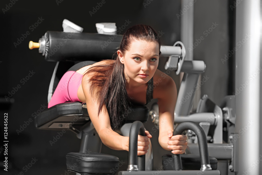 Young woman training in modern gym