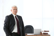 © Africa Studio - Portrait of successful mature businessman in office