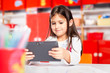 © zorandim75 - Cute little girl using tablet computer