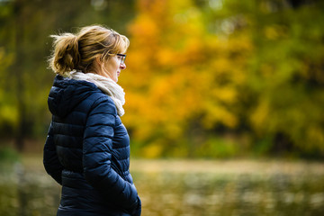 Wall Mural - middle-aged woman walking in city park