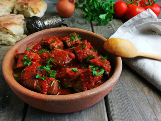 fried pieces of meat stewed in tomato sauce mobile photography