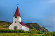 Heavy clouds over the lutheran church in Vik, Iceland