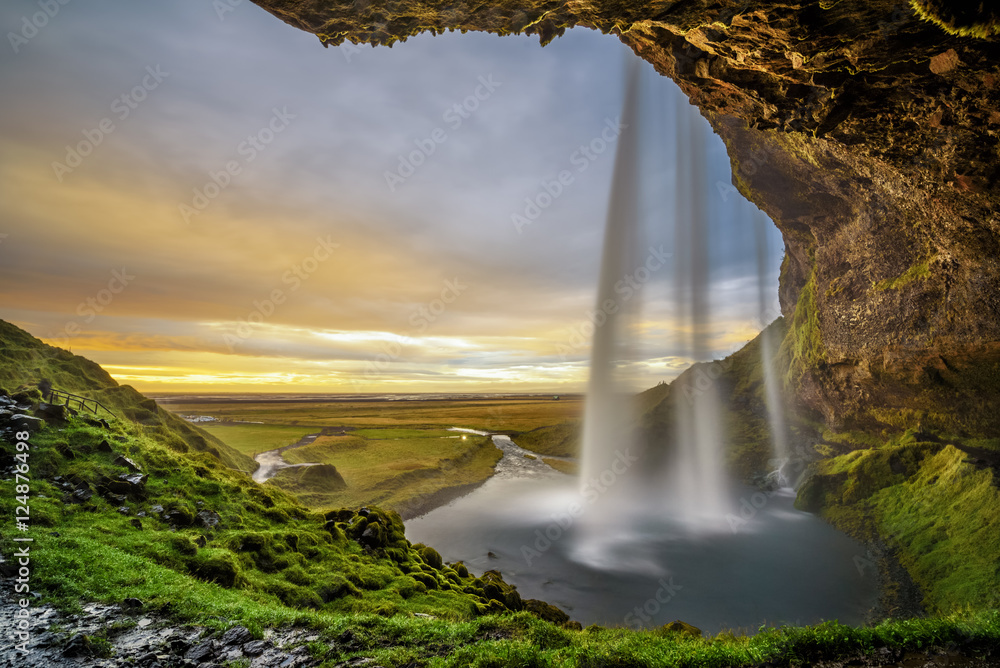Sunset over the famous Seljalandsfoss Waterfall in Iceland Stock Photo ...