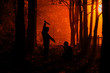 Murder in the park. Maniac kills his victim in the night deserted park. Silhouettes in night foggy forest