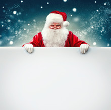 Santa Claus Holding Blank Advertisement Banner Background With Copy Space