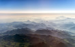 Aerial view of the mountains in the clouds.