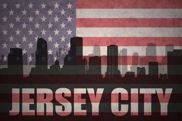 abstract silhouette of the city with text Jersey City at the vintage american flag