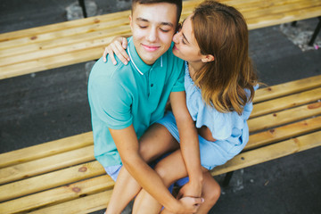 Wall Mural - guy and the girl sitting on a bench