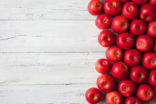 Wooden Background With Red Apples