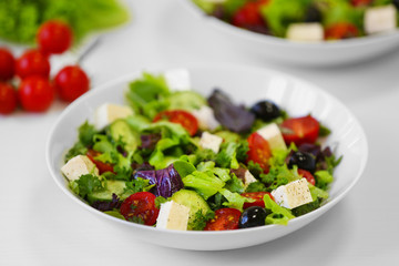 Wall Mural - Fresh delicious salad on white background, closeup