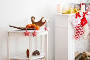 Wall Mural - White table with Christmas decoration in room interior