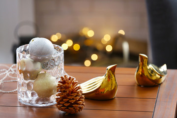 Decorative balls in glass vase on table, closeup